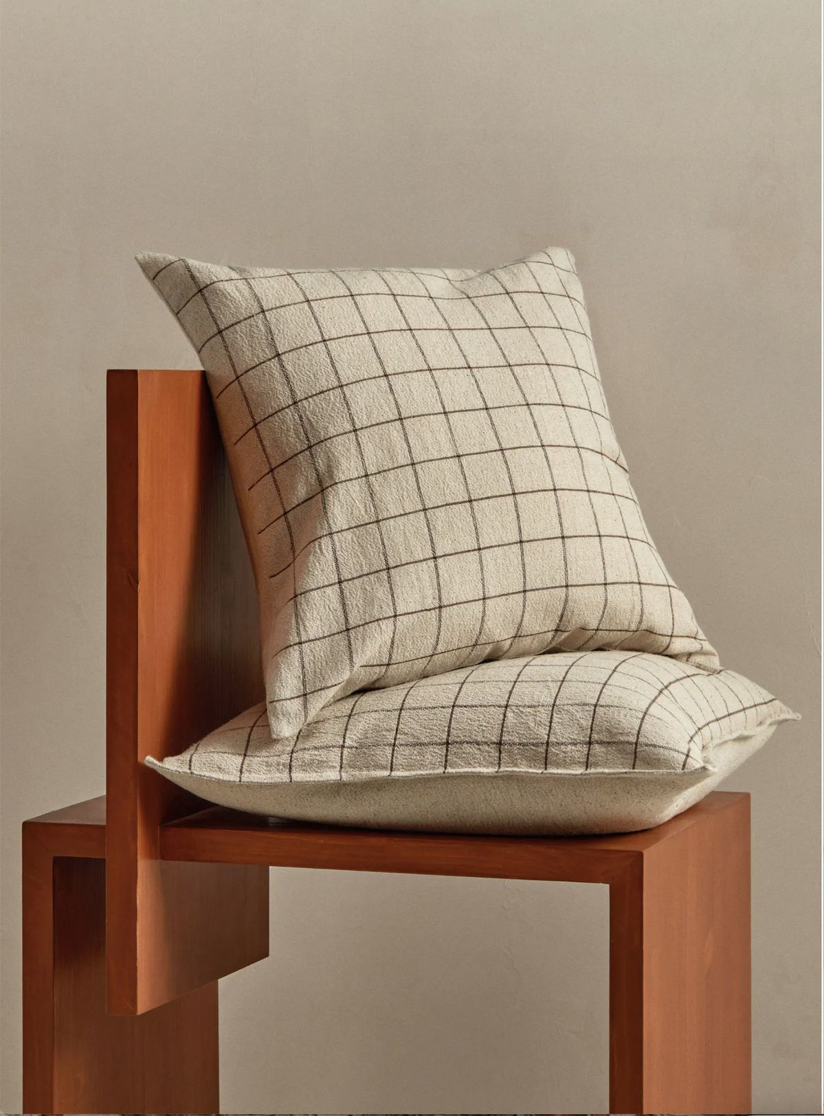 Cushions and throws arranged in an everyday living space